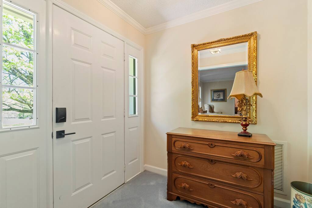 Step into the welcoming foyer—a charming entryway that sets the tone for a relaxing and memorable stay