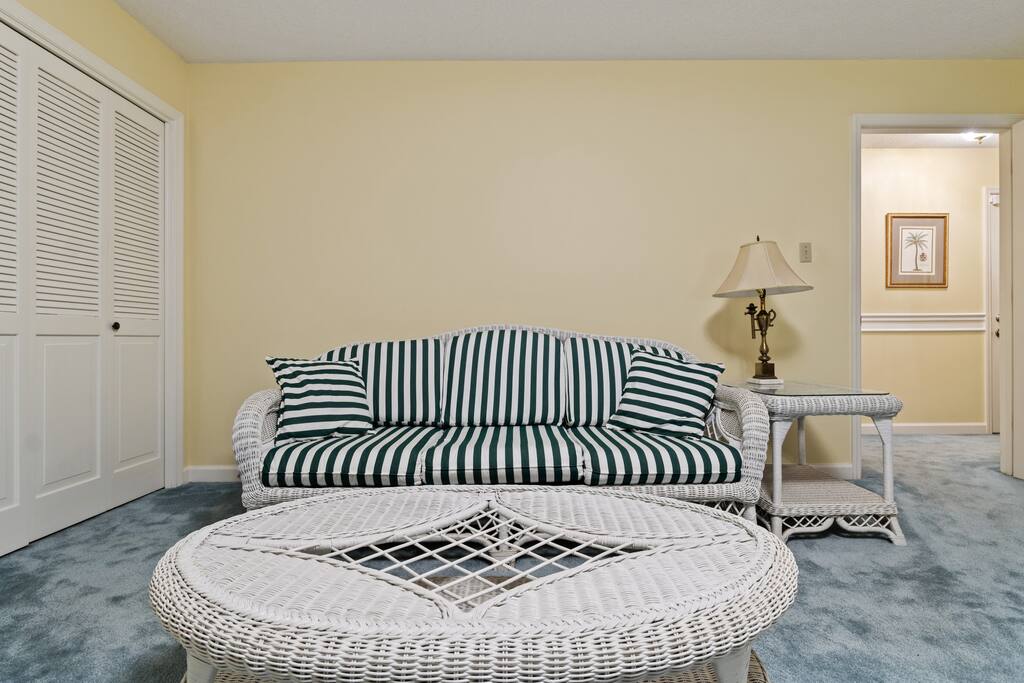 If you're not quite ready to join everyone else in the morning, settle into the beautiful wicker loveseat — the perfect spot to dive into a good book or catch up on the news