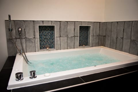Spa-style jetted soaking tub for a relaxing, luxurious stay