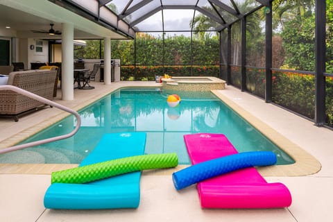Private Poolside Luxury: Indulge in Tranquil Moments with a Soothing Hot Tub and Crystal-Clear Waters