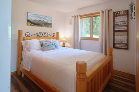 Chill on the bed with the windows open to invite in the cool breeze.