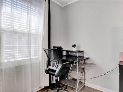 Work-from-home friendly — dedicated desk with fast Wi-Fi and natural lighting