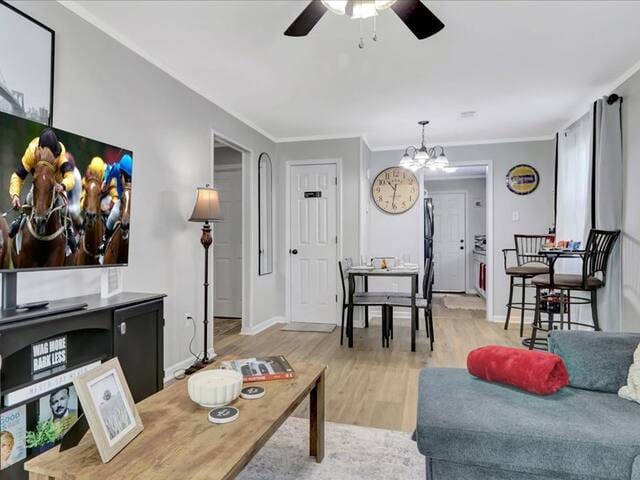 Cozy living space with Smart TV, sofa bed, blackout curtains, and relaxing decor
