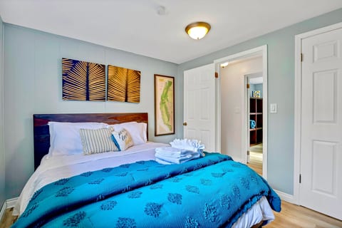 Comfortable queen bedroom with cozy bedding and peaceful ambiance