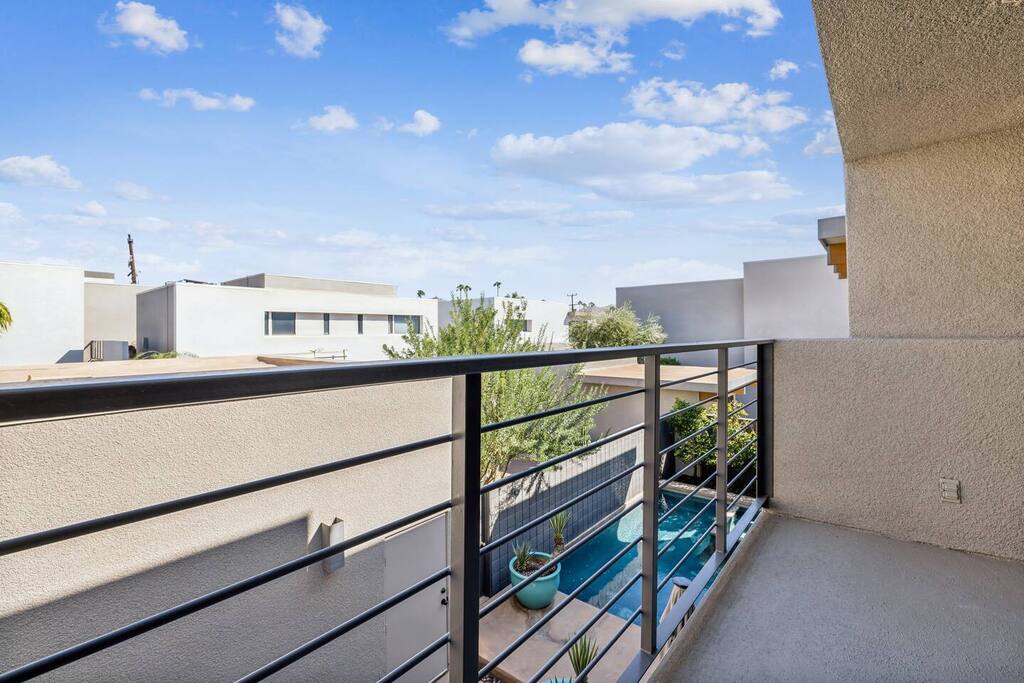 Unwind on our charming balcony, where stunning views meet cozy comfort! Enjoy your morning coffee surrounded by lush plants and gentle breezes. Its the perfect spot to soak in the scenery and savor the tranquility of your getaway. Relax and recharge!