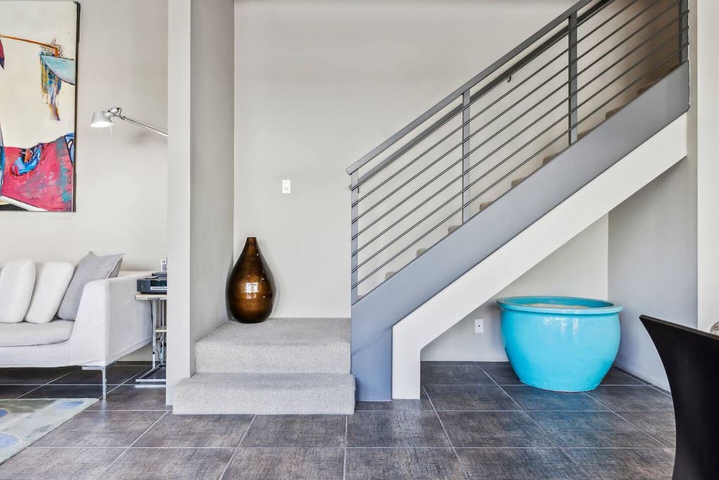 From the dining room, head upstairs to the loft and discover the two additional bedrooms, laundry, and bathrooms.