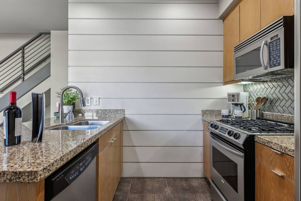 Welcome to our bright and spacious kitchen! Enjoy modern appliances, sleek granite countertops, and a cozy dining nook. Perfect for cooking and gathering, this inviting space is ideal for culinary adventures and memorable meals!