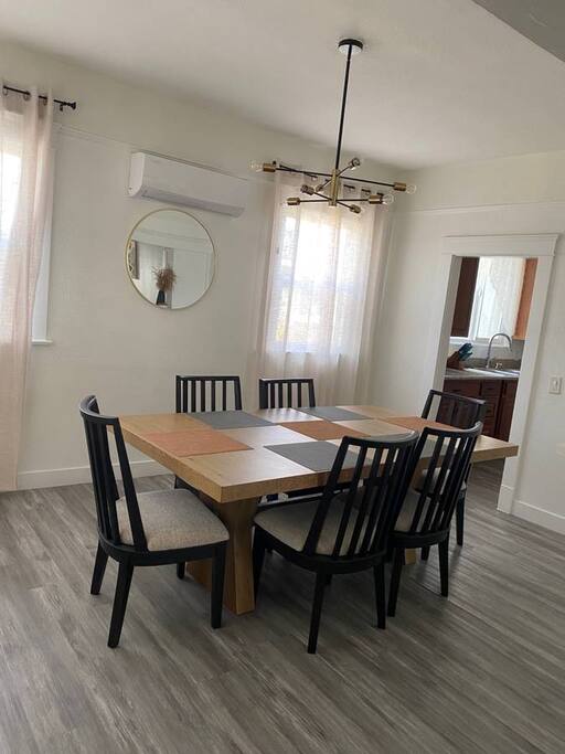 Enjoy meals and make memories in this elegant dining room, where comfort and style come together for the perfect dining experience.