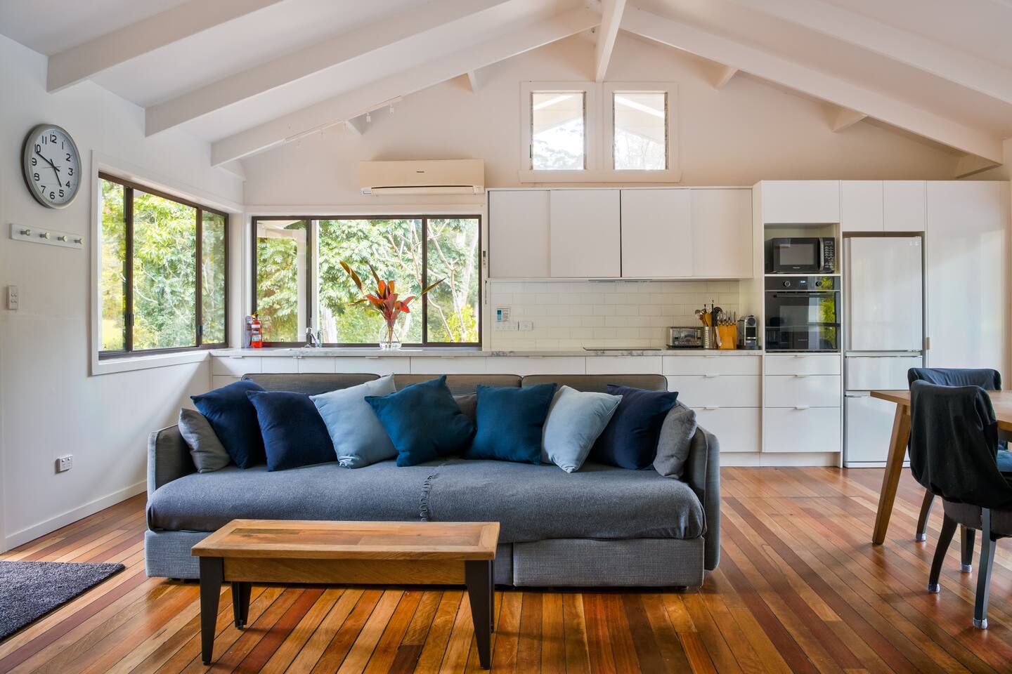 The view of the sofa and kitchen behind, from the TV. 