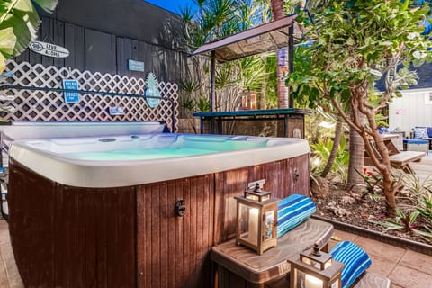 Secluded 6-person hot tub with a hot water outdoor shower