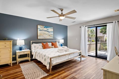 Master bedroom on the first floor with a king size bed, smart tv and cable box with access to its own master bathroom.