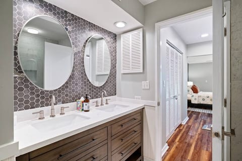 The master bath next to the master bedroom with double sink.