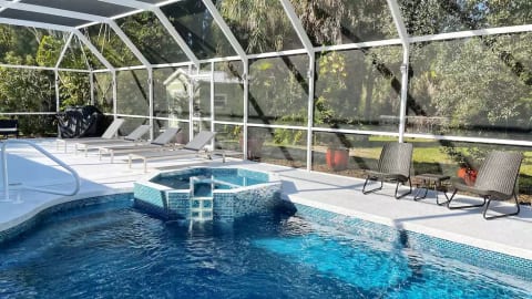 1 of 2 seating areas by the pool