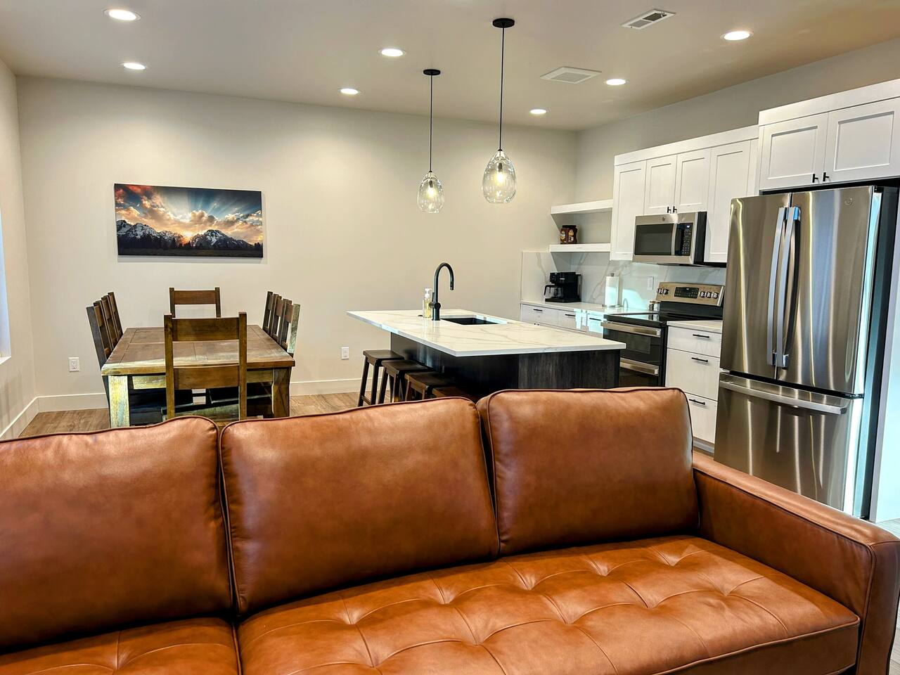 This open-concept main space welcomes you with a bright living room, dining area, and modern kitchen all flowing from the main entryway. It’s a comfortable, family-friendly layout that makes settling in easy after a day on the mountain.