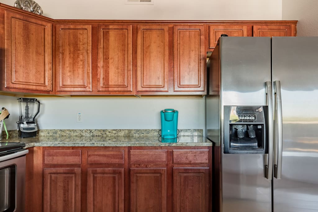 Kitchen with granite counter tops.
