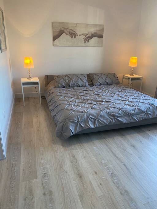 King size bed in the Master Bedroom with Hardwood floors.