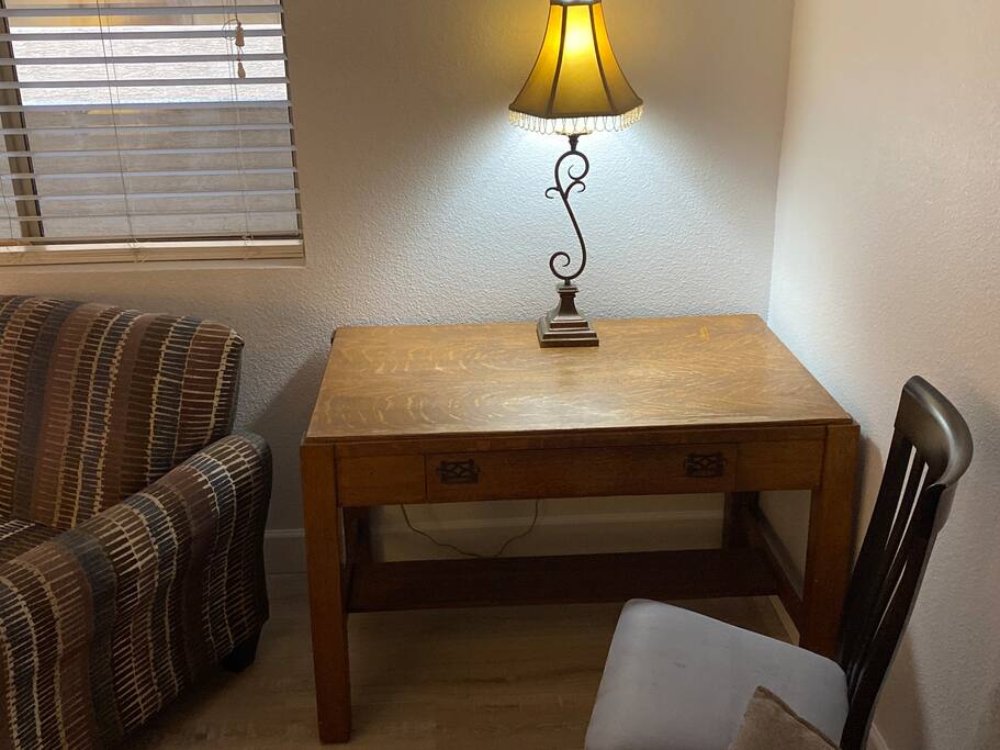 Work desk in a nice cozy Living room.