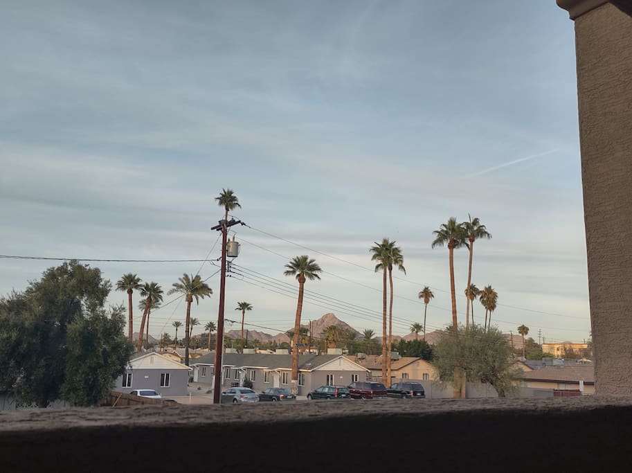 Open sky view on patio with mountains.