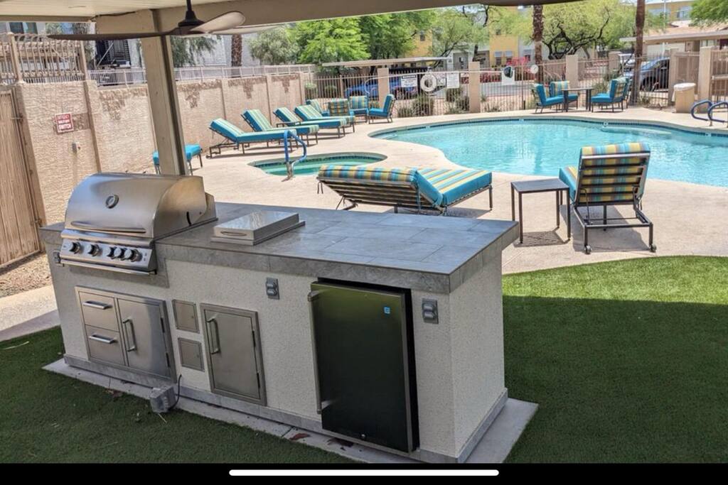 BBQ grill next to the pool and Hot tub. 