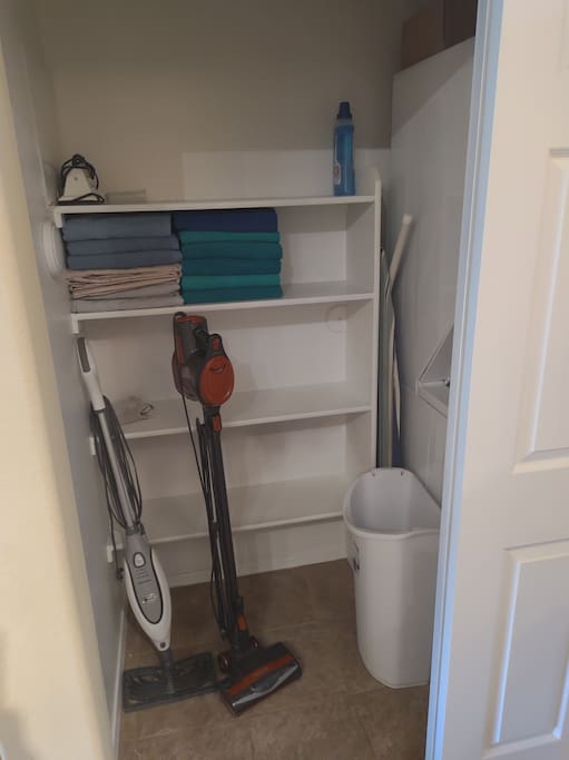 Closet next to washer and dryer.