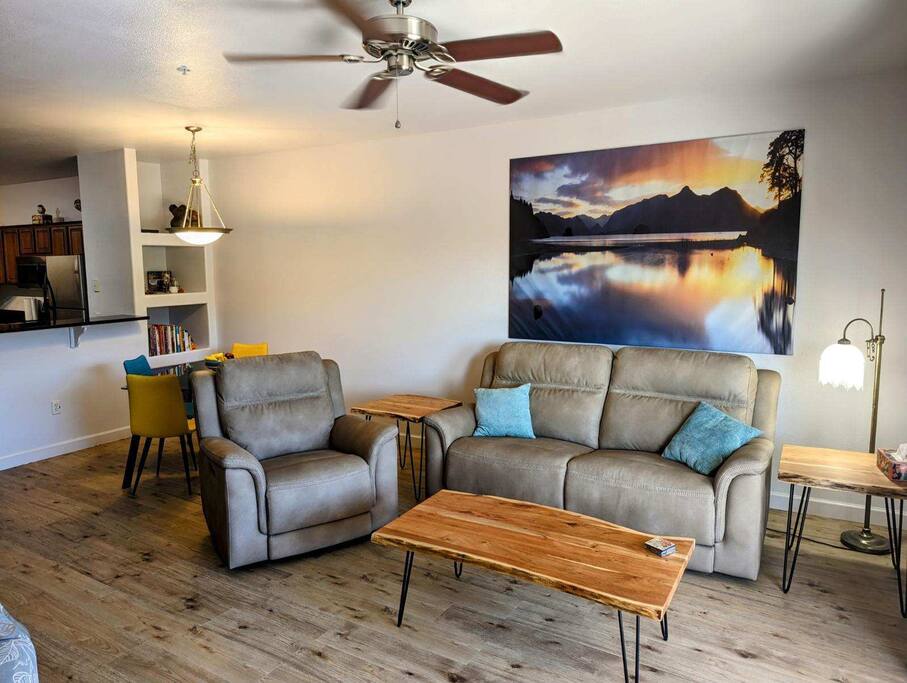 Cozy couch with wood floors.