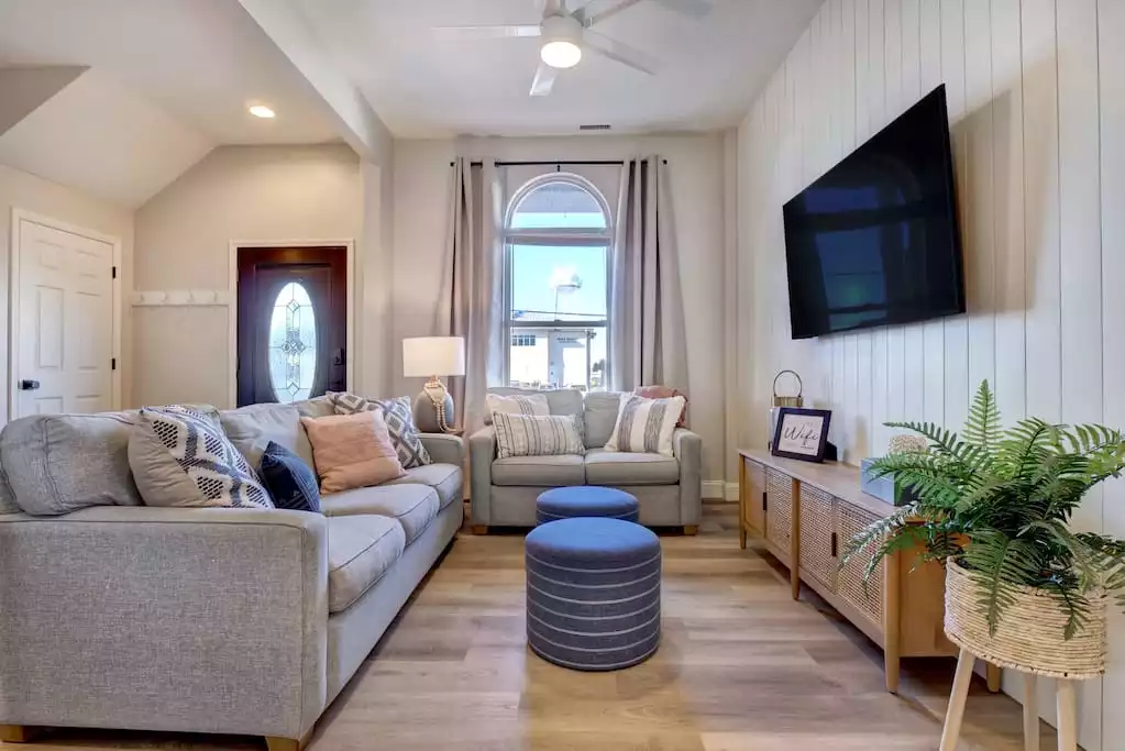 The couch is a sleeper-sofa. Let us know if you plan on using it and we will make sure it has linens set out for you. When it's not acting as a bed it is the perfect 2nd living space so no one has to fight over what movie to watch. - Remodeled Oceanfront Oasis: Family + Pet friendly - Surf City