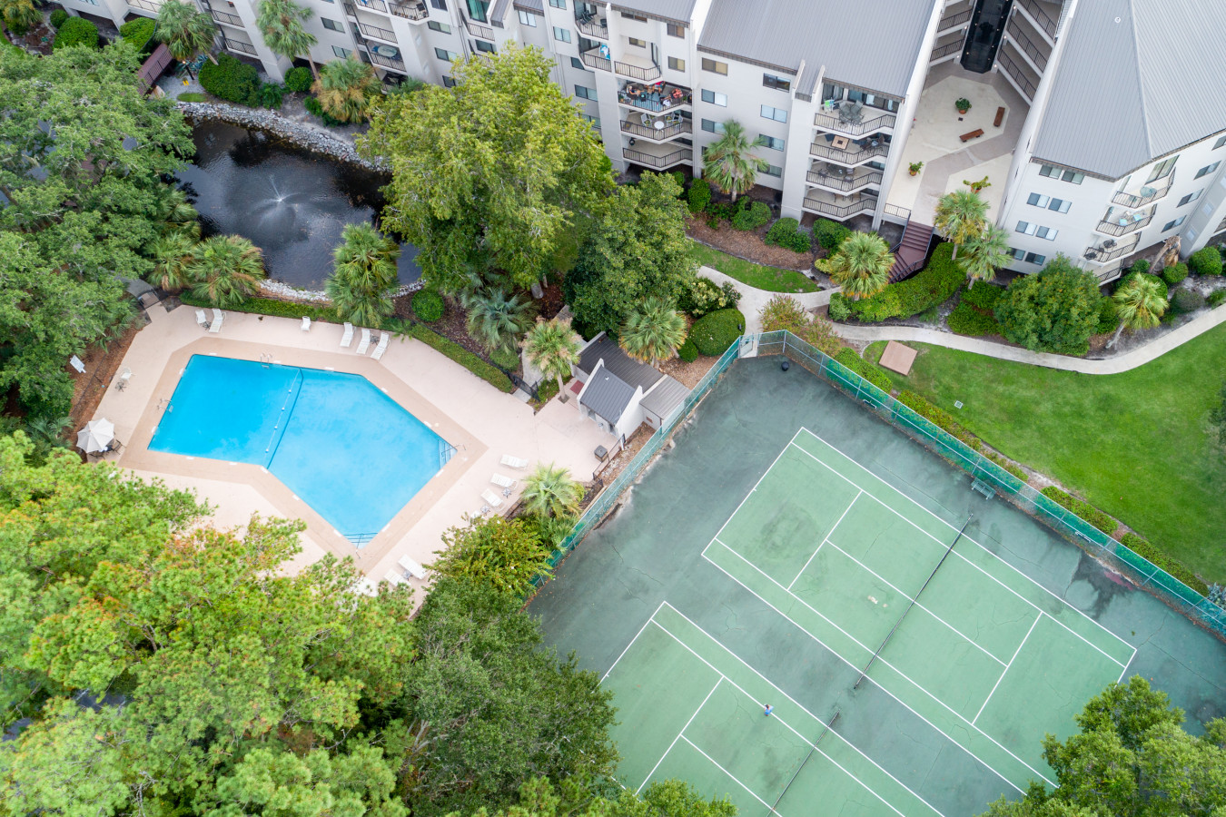 Game, Set, Splash – Aerial Perspective on Tennis and Poolside Fun