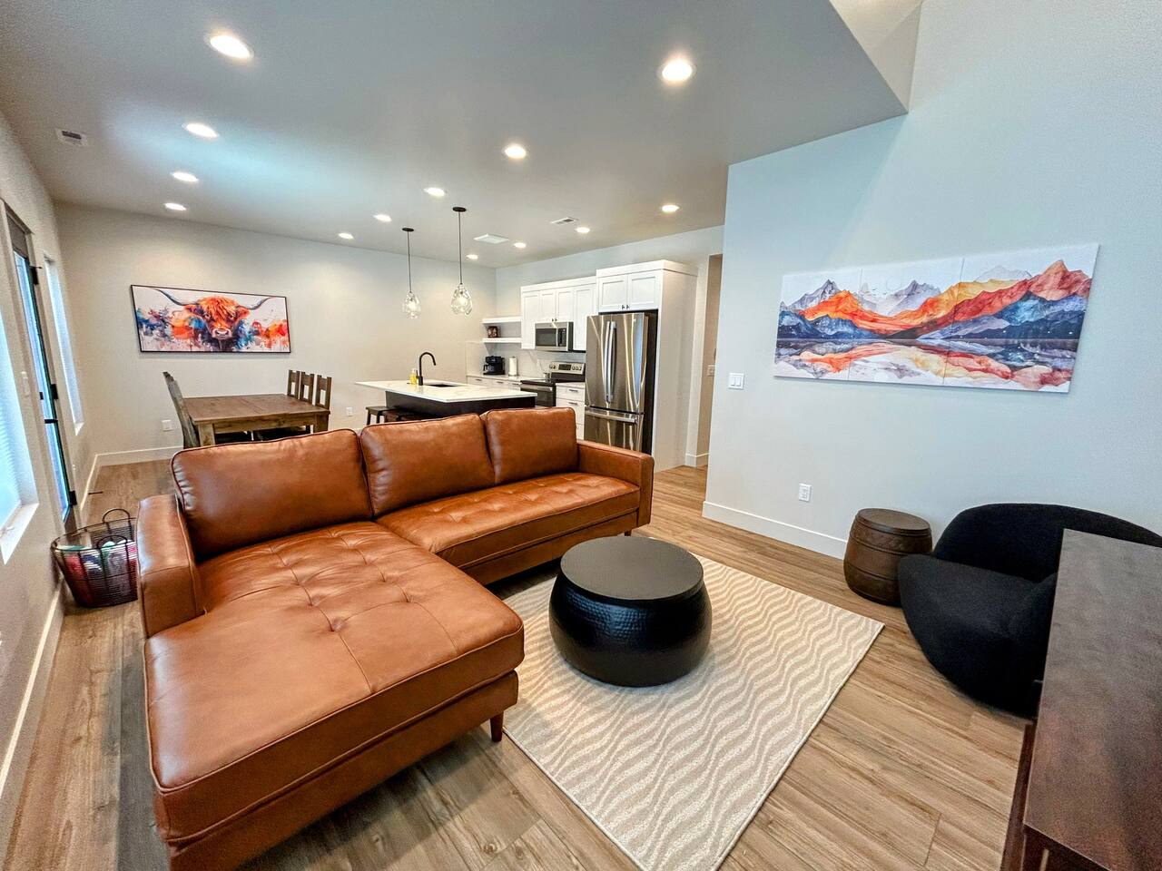 This bright, modern living room offers comfy seating, a cozy decorative fireplace, and a Smart TV—an inviting space for families and skiers to unwind together after a full day exploring Grand Targhee and the Tetons.