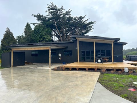 Dual car port and additional parking, dry room with heat pump, plus big deck and spa pool