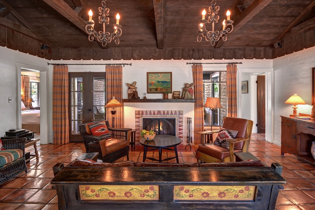 Living room with French doors leading to backyard and pool