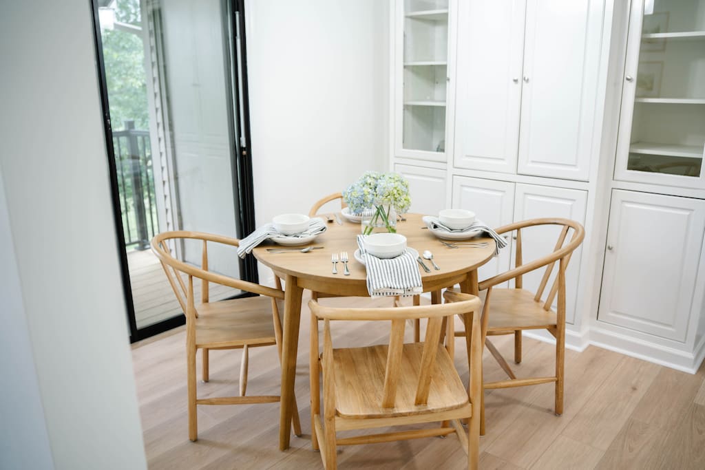 Comfortable and clean dining area with seating for four, tucked between the kitchen and patio for easy flow. Comfortable and clean dining area with seating for four, tucked between the kitchen and patio for easy flow. - Peaceful & Convenient 2BR Near Ballantyne - Charlotte