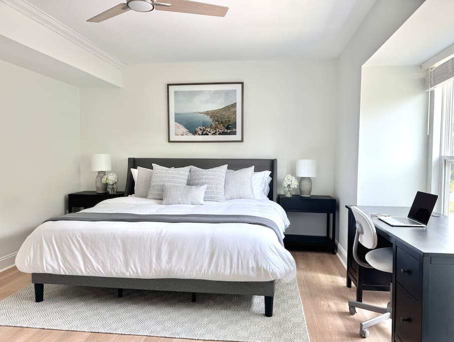 Spacious bedroom with a king bed, natural light and a desk setup—great for work or extended stays. Spacious bedroom with a king bed, natural light and a desk setup—great for work or extended stays. - Peaceful & Convenient 2BR Near Ballantyne - Charlotte