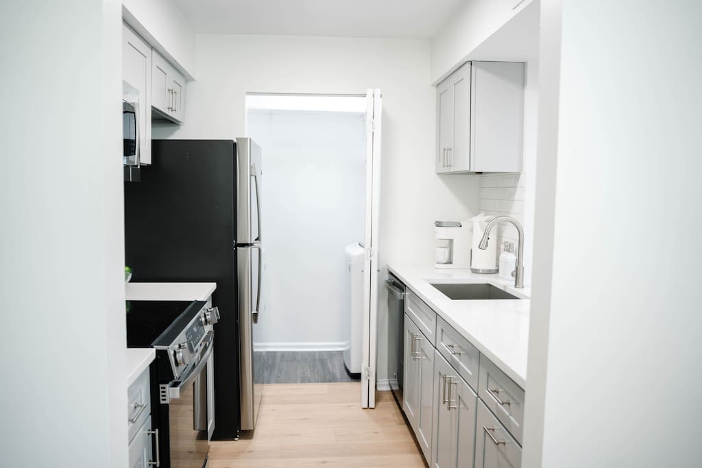 Well-equipped kitchen with full-size appliances and everything you need for cooking during your stay. Well-equipped kitchen with full-size appliances and everything you need for cooking during your stay. - Peaceful & Convenient 2BR Near Ballantyne - Charlotte