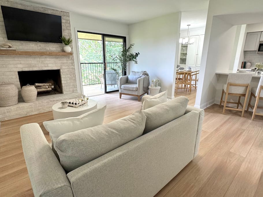 Bright, open living space with updated furnishings, smart TV, and access to the private patio—ideal for relaxing after a busy day. Bright, open living space with updated furnishings, smart TV, and access to the private patio—ideal for relaxing after a busy day. - Peaceful & Convenient 2BR Near Ballantyne - Charlotte