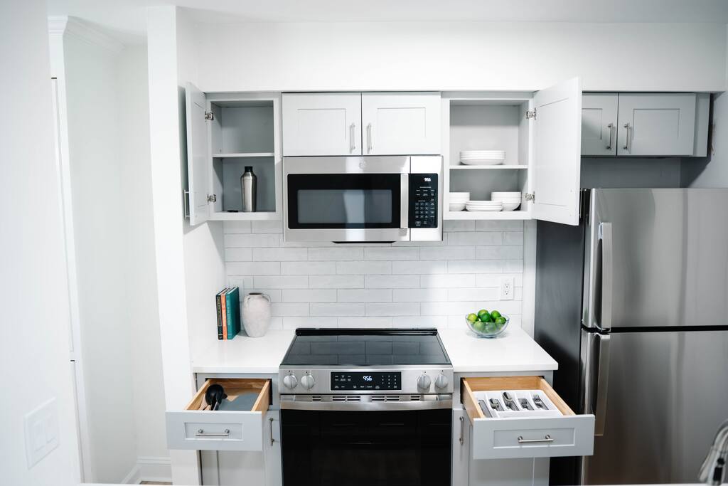 Modern appliances with easy-access utensils and cooking tools at your fingertips. Modern appliances with easy-access utensils and cooking tools at your fingertips. - Peaceful & Convenient 2BR Near Ballantyne - Charlotte