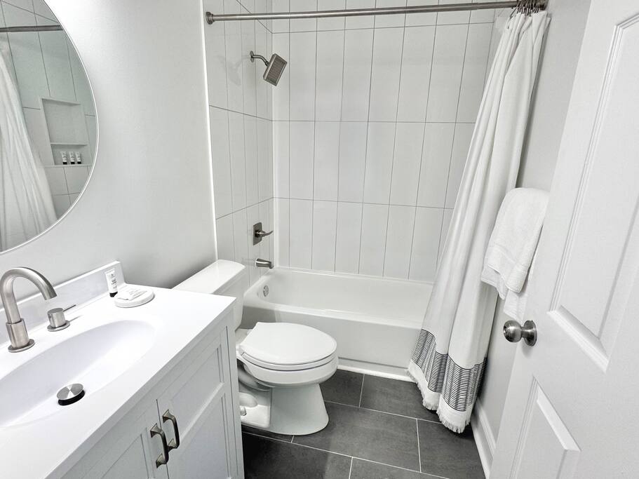 Second full bathroom with a tiled shower/tub combo—perfect for relaxing or freshening up after a long day. Second full bathroom with a tiled shower/tub combo—perfect for relaxing or freshening up after a long day. - Peaceful & Convenient 2BR Near Ballantyne - Charlotte