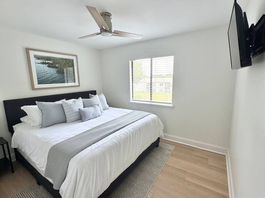 Second bedroom with a king bed, natural light and smart TV. Second bedroom with a king bed, natural light and smart TV. - Peaceful & Convenient 2BR Near Ballantyne - Charlotte