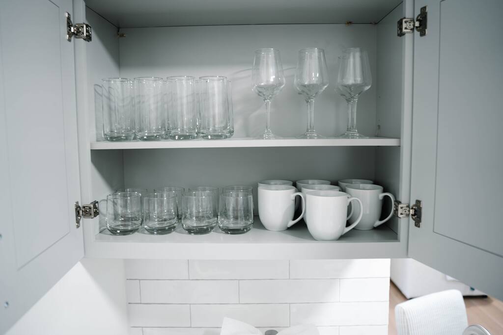 Stocked with wine glasses, mugs, and glassware for both casual sips and cozy nights in. Stocked with wine glasses, mugs, and glassware for both casual sips and cozy nights in. - Peaceful & Convenient 2BR Near Ballantyne - Charlotte