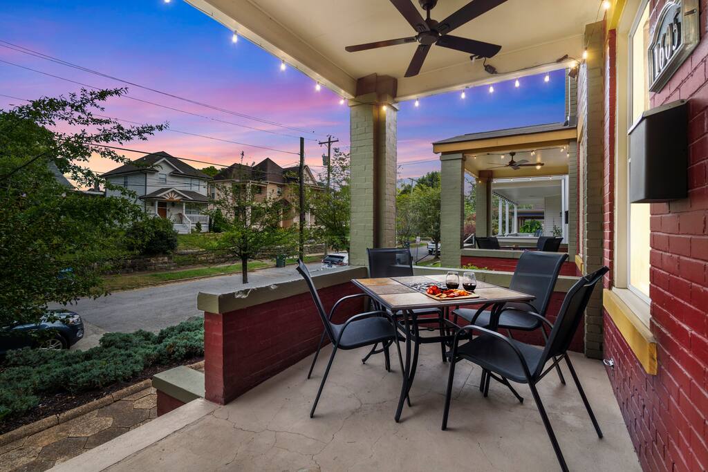 Enjoy your morning coffee or evening wine on this inviting front porch, complete with a shaded dining set and views of the quiet, tree-lined street