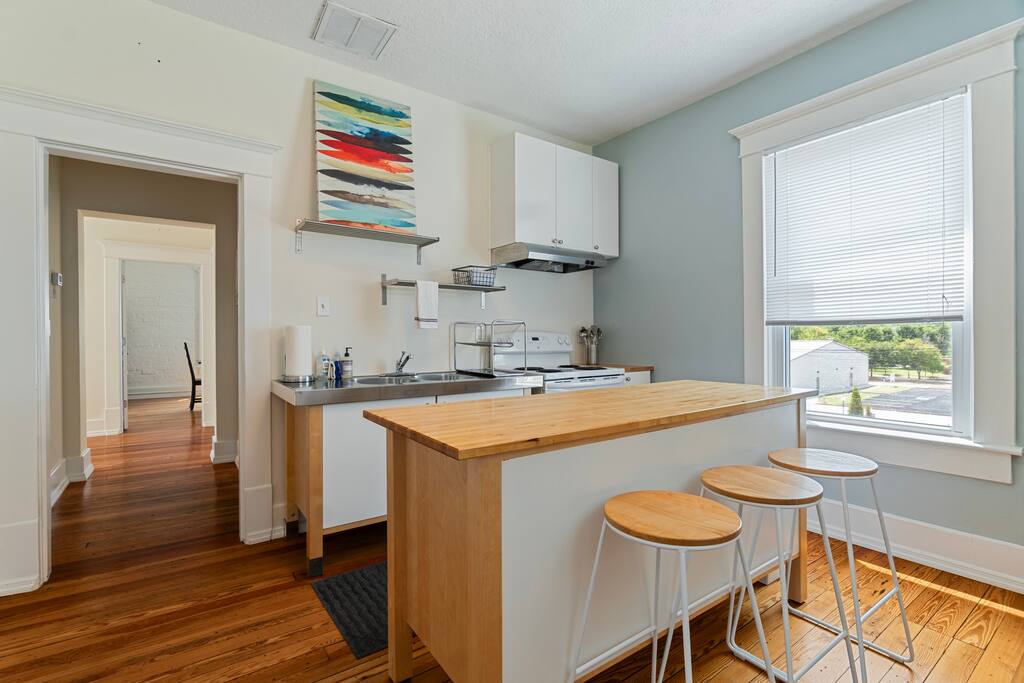 Cook with ease in this bright and cheerful kitchen, fully equipped with a modern electric stove, open shelving, and all the essentials for a home-cooked meal ( please note: there is not dishwasher) Cook with ease in this bright and cheerful kitchen, fully equipped with a modern electric stove, open shelving, and all the essentials for a home-cooked meal ( please note: there is not dishwasher) - Walk to Choo Choo - Free Off Street Parking - Cozy - Chattanooga
