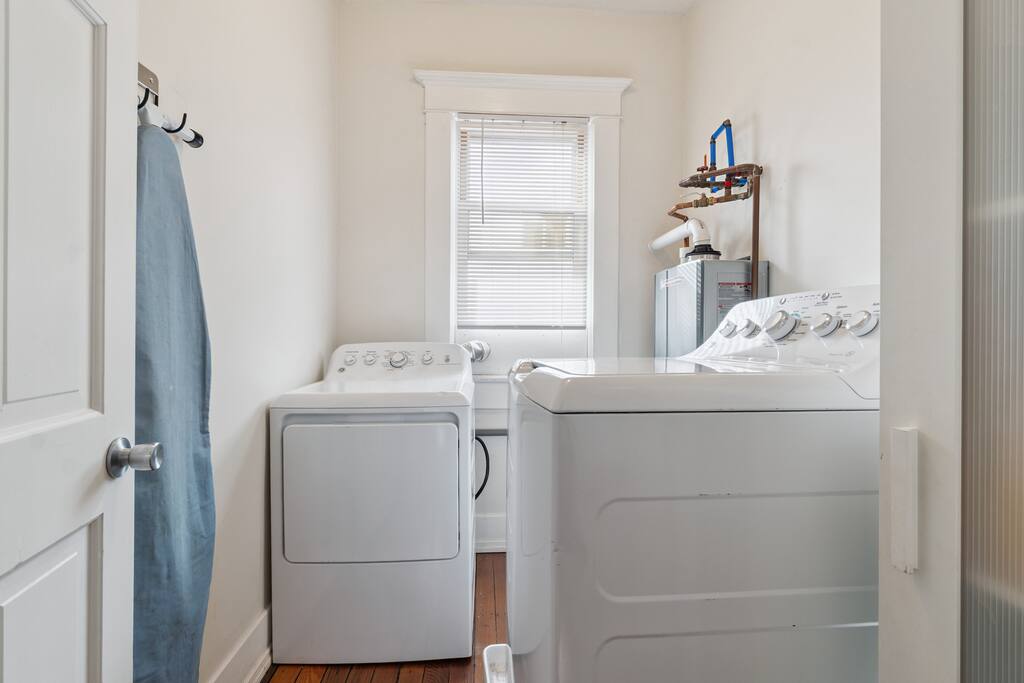 Enjoy the convenience of in-home laundry with a bright utility room featuring a full-size washer and dryer, detergent, iron, and ironing board and essentials ready to go. Enjoy the convenience of in-home laundry with a bright utility room featuring a full-size washer and dryer, detergent, iron, and ironing board and essentials ready to go. - Walk to Choo Choo - Free Off Street Parking - Cozy - Chattanooga