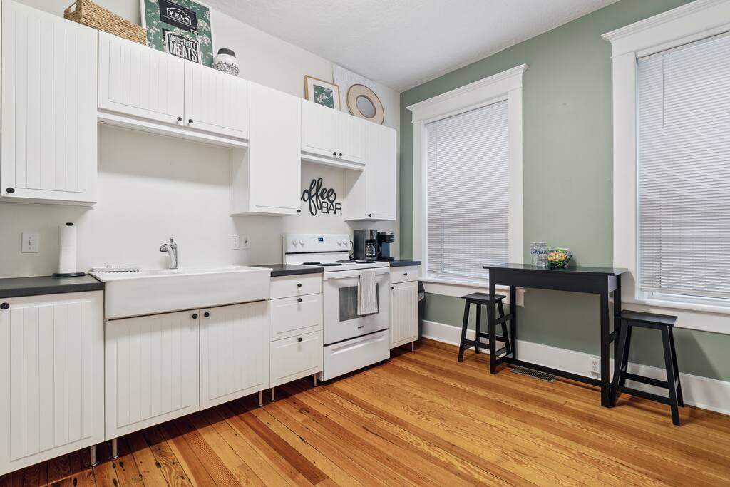 Whip up a meal or plate up your favorite takeout in this bright, cheerful downstairs kitchen—complete with a cozy dining nook, coffee bar, and all the essentials (just no dishwasher) Whip up a meal or plate up your favorite takeout in this bright, cheerful downstairs kitchen—complete with a cozy dining nook, coffee bar, and all the essentials (just no dishwasher) - In Southside | Roomy 6 Bedroom | Walk to Choo Choo - Chattanooga