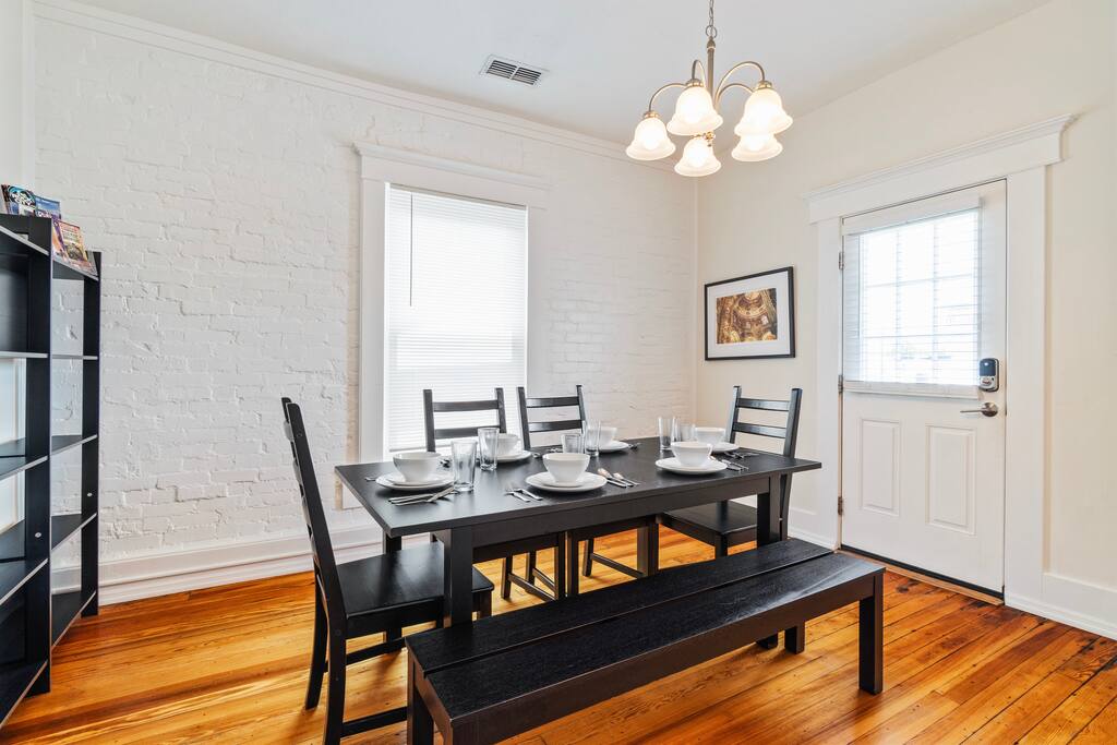 Gather around the spacious upstairs dining table, where seating for six and plenty of natural light create the perfect setting for shared meals, games, or planning your next adventure Gather around the spacious upstairs dining table, where seating for six and plenty of natural light create the perfect setting for shared meals, games, or planning your next adventure - In Southside | Roomy 6 Bedroom | Walk to Choo Choo - Chattanooga