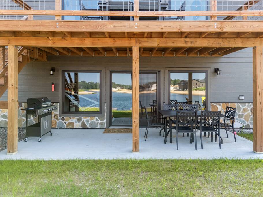 The patio can be accessed through the walk out basement or porch stairs and is sheltered by the porch above. It features an outdoor dining set with table and 6 chairs and propane grill for your use. Propane and grilling tools are provided. The patio can be accessed through the walk out basement or porch stairs and is sheltered by the porch above. It features an outdoor dining set with table and 6 chairs and propane grill for your use. Propane and grilling tools are provided. - New Listing Lakeside Beach Sleeps 15+ Pet friendly - New Lisbon
