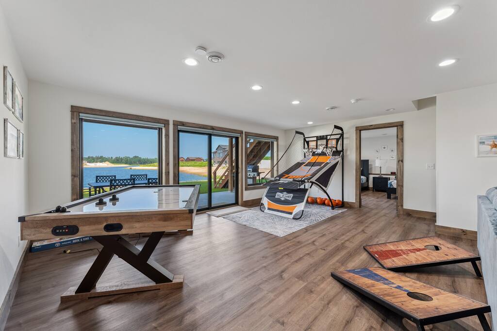 Basement game area features an air hockey table, basketball arcade game, giant connect four, board games, books and coloring activities. Basement game area features an air hockey table, basketball arcade game, giant connect four, board games, books and coloring activities. - New Listing Lakeside Beach Sleeps 15+ Pet friendly - New Lisbon