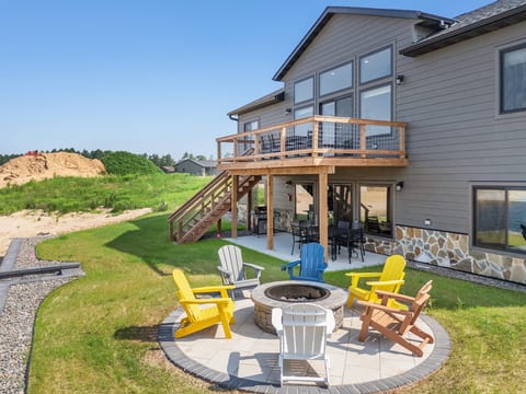Spacious backyard with deck, fire pit patio, and outdoor seating