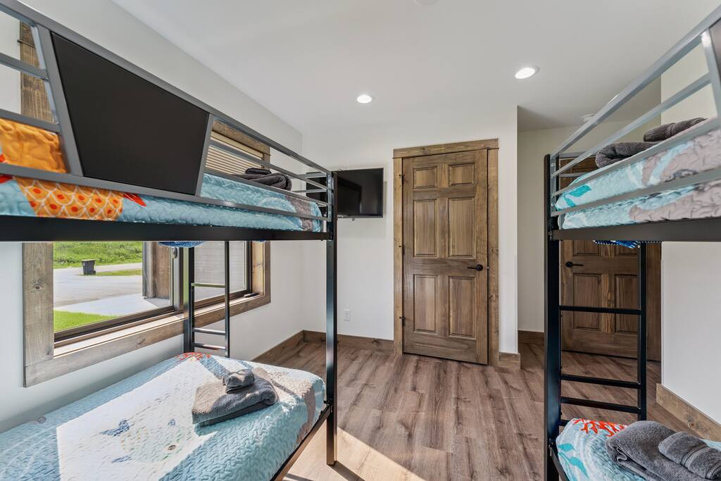 Bedroom 3 features 2 bunk beds (4 twin beds), TV with Roku streaming services and a closet with hangers. Bedroom 3 features 2 bunk beds (4 twin beds), TV with Roku streaming services and a closet with hangers. - New Listing Lakeside Beach Sleeps 15+ Pet friendly - New Lisbon