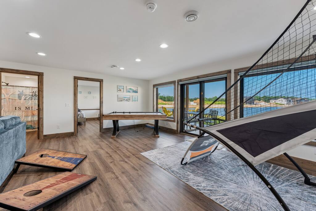 Basement game area features an air hockey table, basketball arcade game, giant connect four, board games, books and coloring activities. Basement game area features an air hockey table, basketball arcade game, giant connect four, board games, books and coloring activities. - New Listing Lakeside Beach Sleeps 15+ Pet friendly - New Lisbon