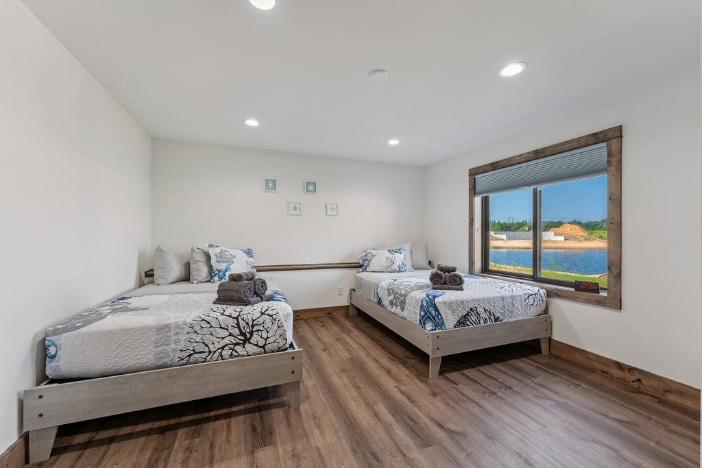 Bedroom 4 features 2 full beds, TV with Roku streaming services and a closet with hangers. Bedroom 4 features 2 full beds, TV with Roku streaming services and a closet with hangers. - New Listing Lakeside Beach Sleeps 15+ Pet friendly - New Lisbon