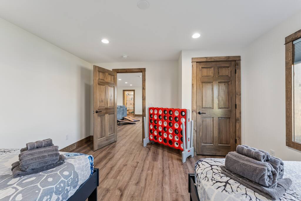 Bedroom 5 features 2 full beds, TV with Roku streaming services and a closet with hangers. Bedroom 5 features 2 full beds, TV with Roku streaming services and a closet with hangers. - New Listing Lakeside Beach Sleeps 15+ Pet friendly - New Lisbon